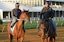 Epicenter (left) being led off the track following morning workouts at Pimlico Race Course.