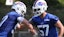 Bills edge Joey Bosa punches the ball out of the hands of A.J. Epenesa.