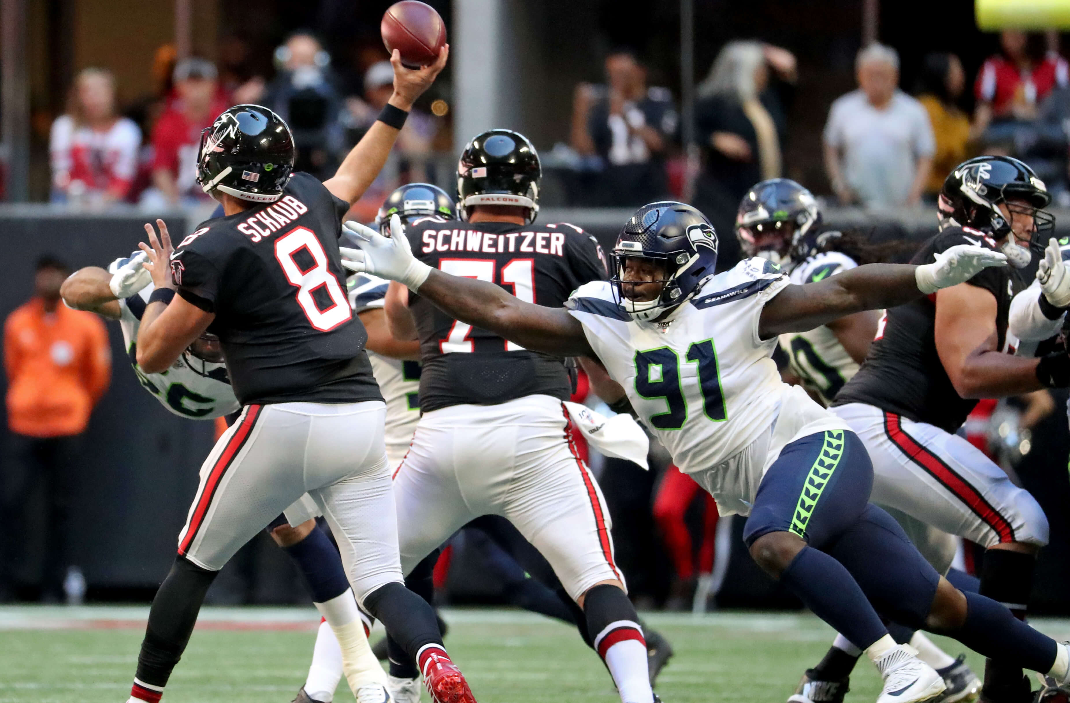 Atlanta Falcons quarterback Matt Schaub (8) throws a pass against pressure from Seattle Seahawks defensive tackle Jarran Reed (91) in the second quarter at Mercedes-Benz Stadium.
