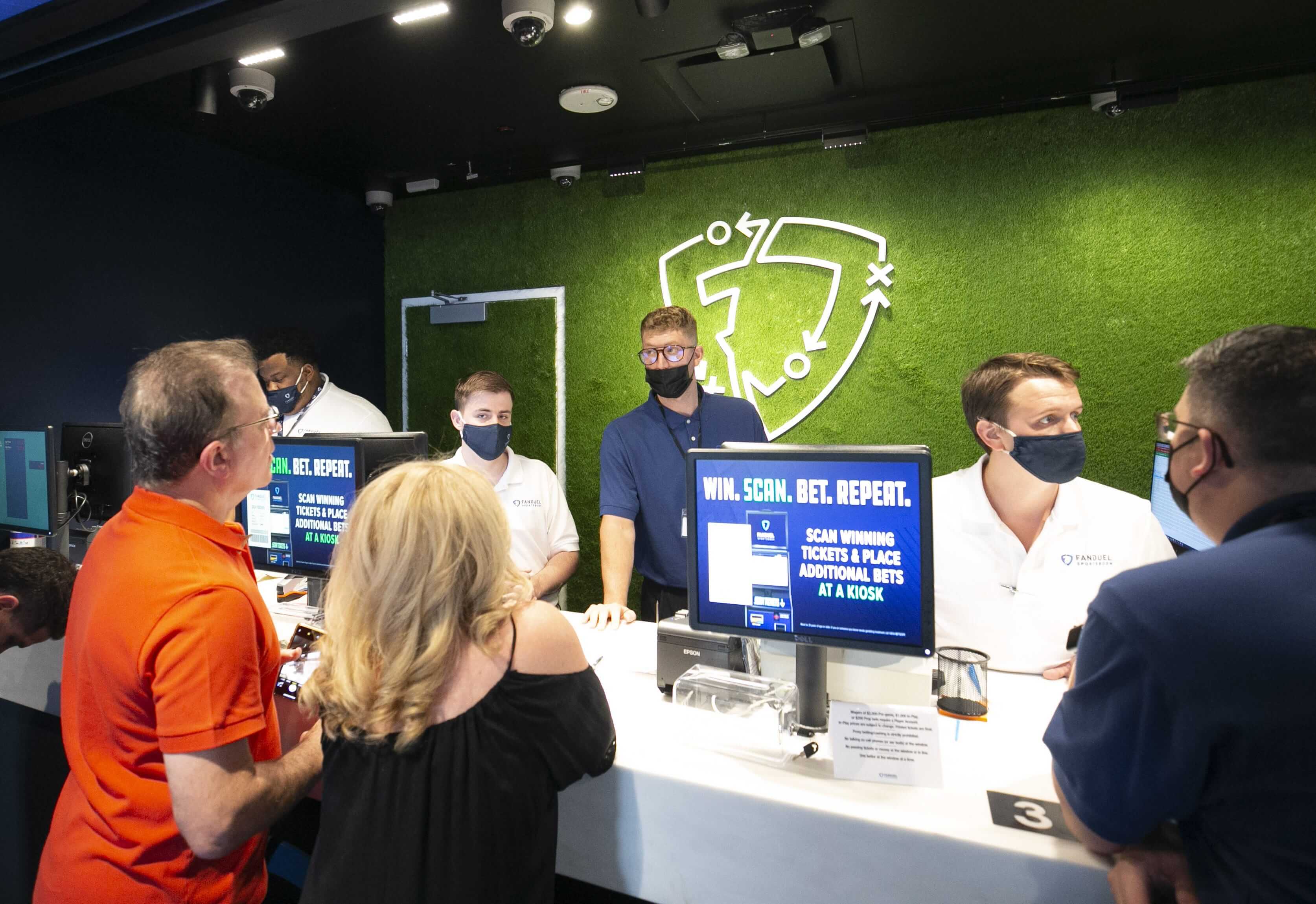 People place bets at the FanDuel Sportsbook at the Footprint Center in Phoenix on opening day on Sept. 9, 2021. Fanduel Sportsbook At Footprint Center