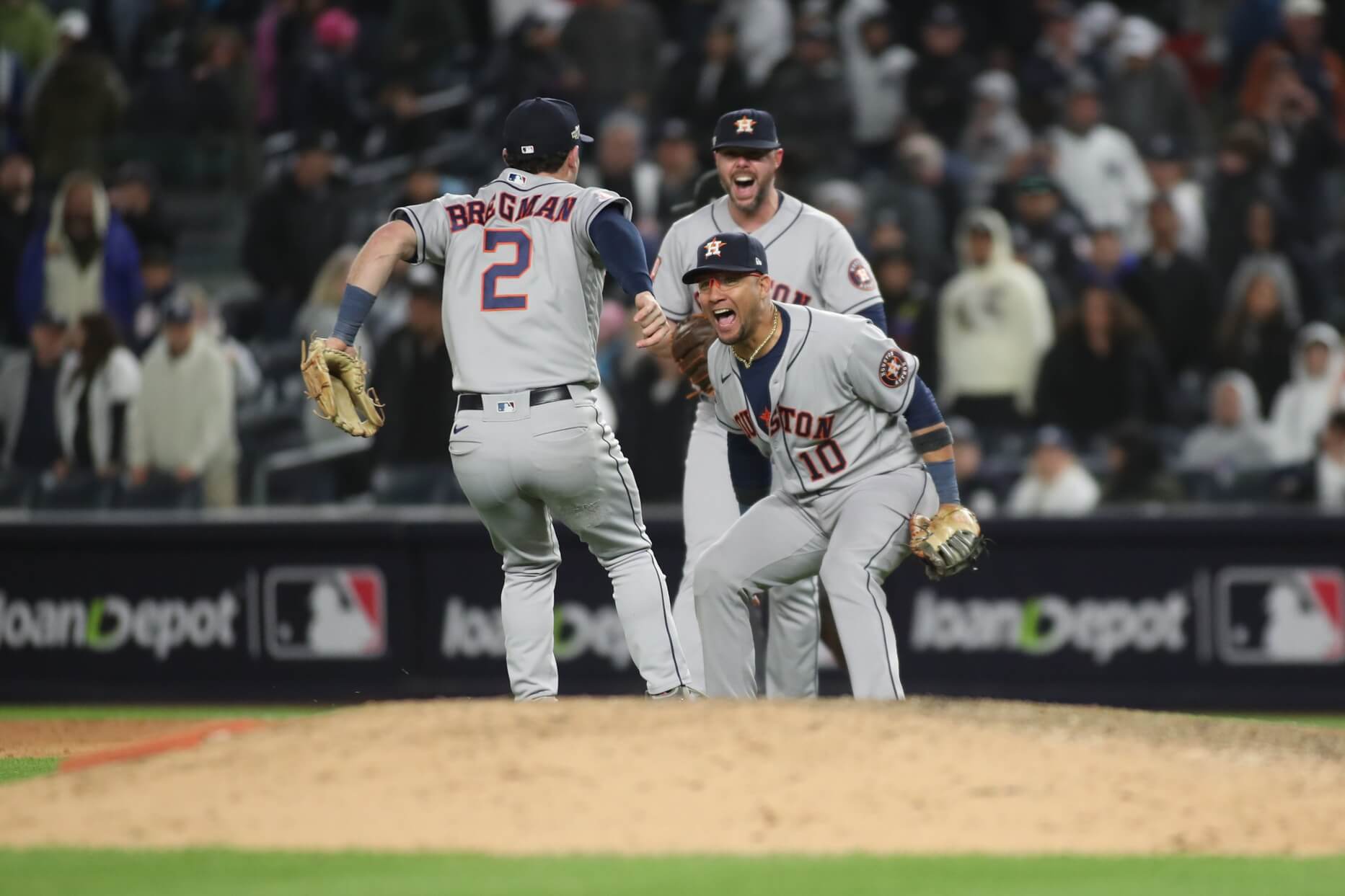 Houston Astros third baseman Alex Bregman (2) celebrates with Houston Astros first baseman Yuli Gurriel (10) after defeating the New York Yankees during game four of the ALCS for the 2022 MLB Playoffs at Yankee Stadium.
