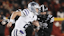 Kansas State Wildcats quarterback Avery Johnson (2) runs with the ball around Iowa State Cyclones linebacker Will McLaughlin (23).