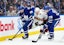 Ottawa Senators right wing Michael Amadio (22) battles for the puck with Toronto Maple Leafs defenseman Conor Timmins (25) during the second period at Scotiabank Arena. Mandatory Credit: Nick Turchiaro-Imagn Images