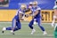 Winnipeg Blue Bombers running back Brady Oliveira (20) takes a handoff from quarterback Zach Collaros (8) against the Saskatchewan Roughriders.