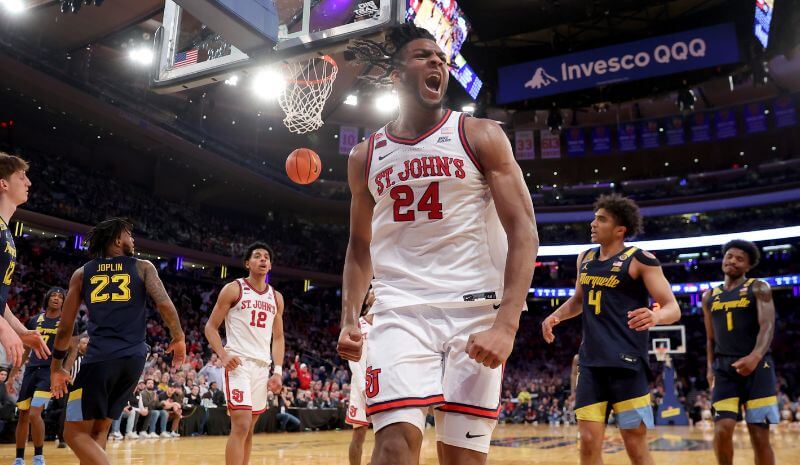 St. John's Red Storm forward Zuby Ejiofor (24) reacts after a basket and a foul.