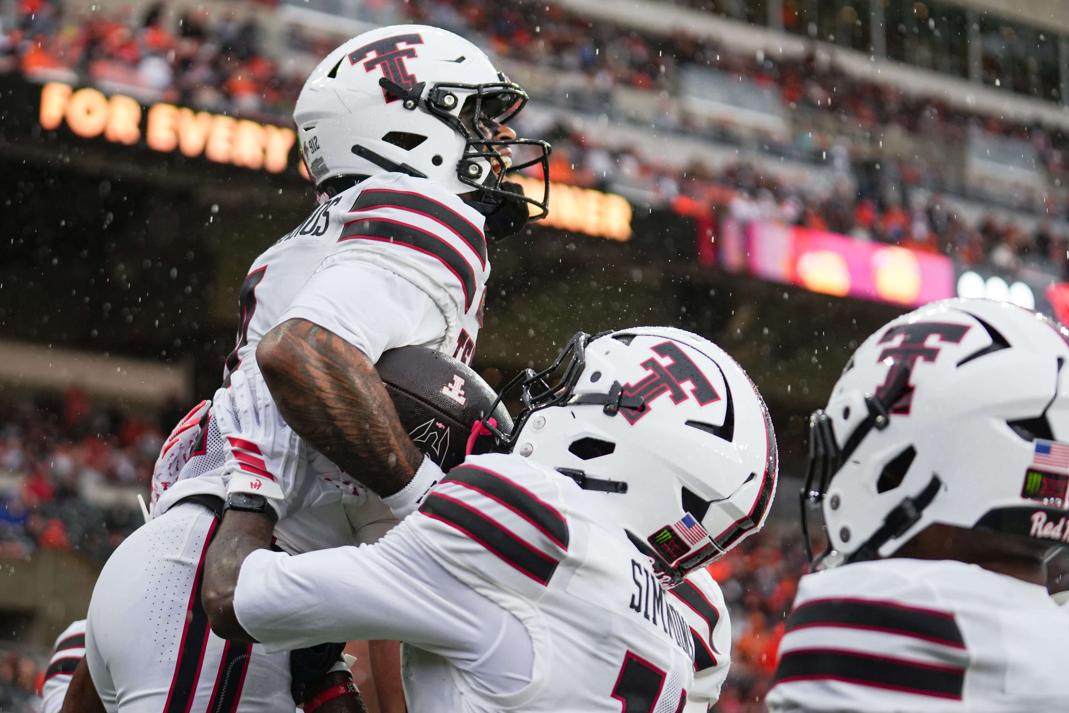 Houston vs Texas Tech betting guide, Texas Tech's Thomas Castellanos celebrates with his teammates after scoring a touchdown.