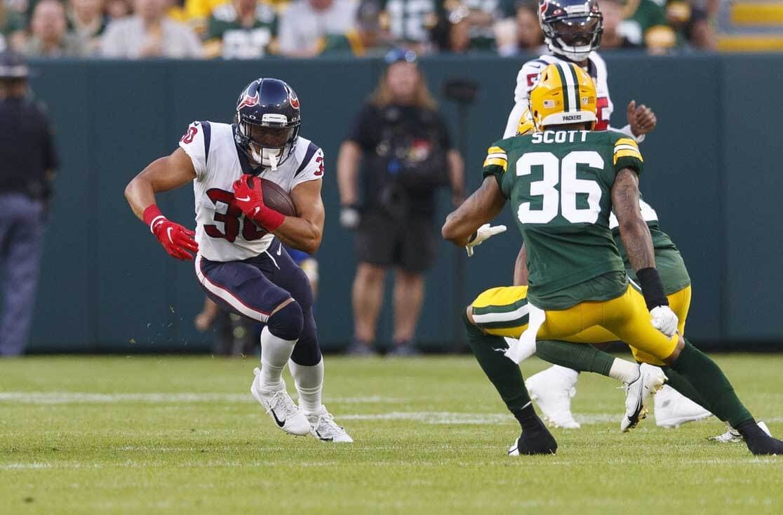Houston Texans running back Phillip Lindsay (30) runs the football against the Green Bay Packers during the first quarter at Lambeau Field.