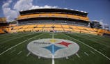 General view of the logo on the fifty yard line before the Pittsburgh Steelers host the Tampa Bay Buccaneers at Acrisure Stadium. Charles LeClaire-Imagn Images