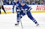 Toronto Maple Leafs forward Auston Matthews (34) carries the puck up ice against the Arizona Coyotes in the first period at Scotiabank Arena.