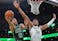 Boston Celtics forward Jayson Tatum (0) attacks the hoop in NBA action.