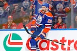 Edmonton Oilers forward Leon Draisaitl (29) celebrates after scoring his 50th goal of the season during the third period against the Calgary Flames at Rogers Place. Mandatory Credit: Perry Nelson-Imagn Images