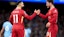  Liverpool's Mohamed Salah (left) celebrates scoring their side's first goal of the game with teammate Alexis Mac Allister.