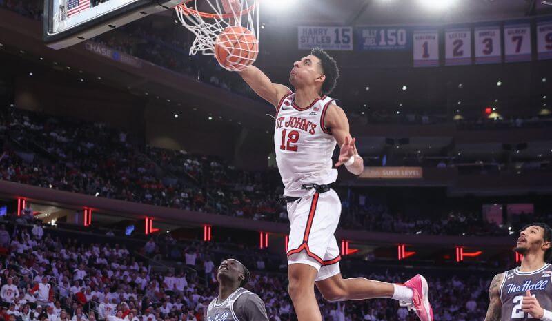 St. John's Red Storm guard RJ Luis Jr. (12) dunks in the second half against the Seton Hall Pirates.