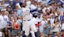 Chicago Cubs shortstop Dansby Swanson (7) hits a sacrifice fly.