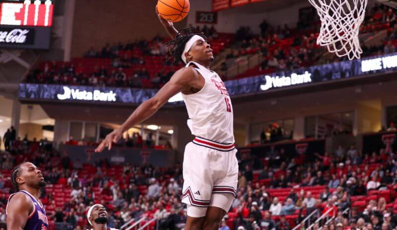 Texas Tech's JT Toppin rises for a dunk in a non-conference Division I basketball game.