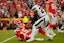 Houston Texans safety Eric Murray (23) assists Kansas City Chiefs quarterback Patrick Mahomes (15) up from the ground after a play during the second quarter of a 2025 AFC divisional round game at GEHA Field at Arrowhead Stadium.Jay Biggerstaff-Imagn Images