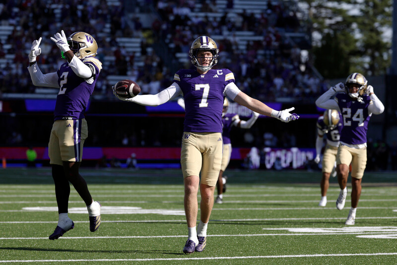 Washington vs Purdue Prediction. Washington safety Alex McLaughlin (7) celebrates an interception.