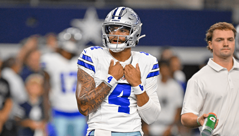 Dallas Cowboys quarterback Dak Prescott celebrates with wide receiver George Pickens NFL.