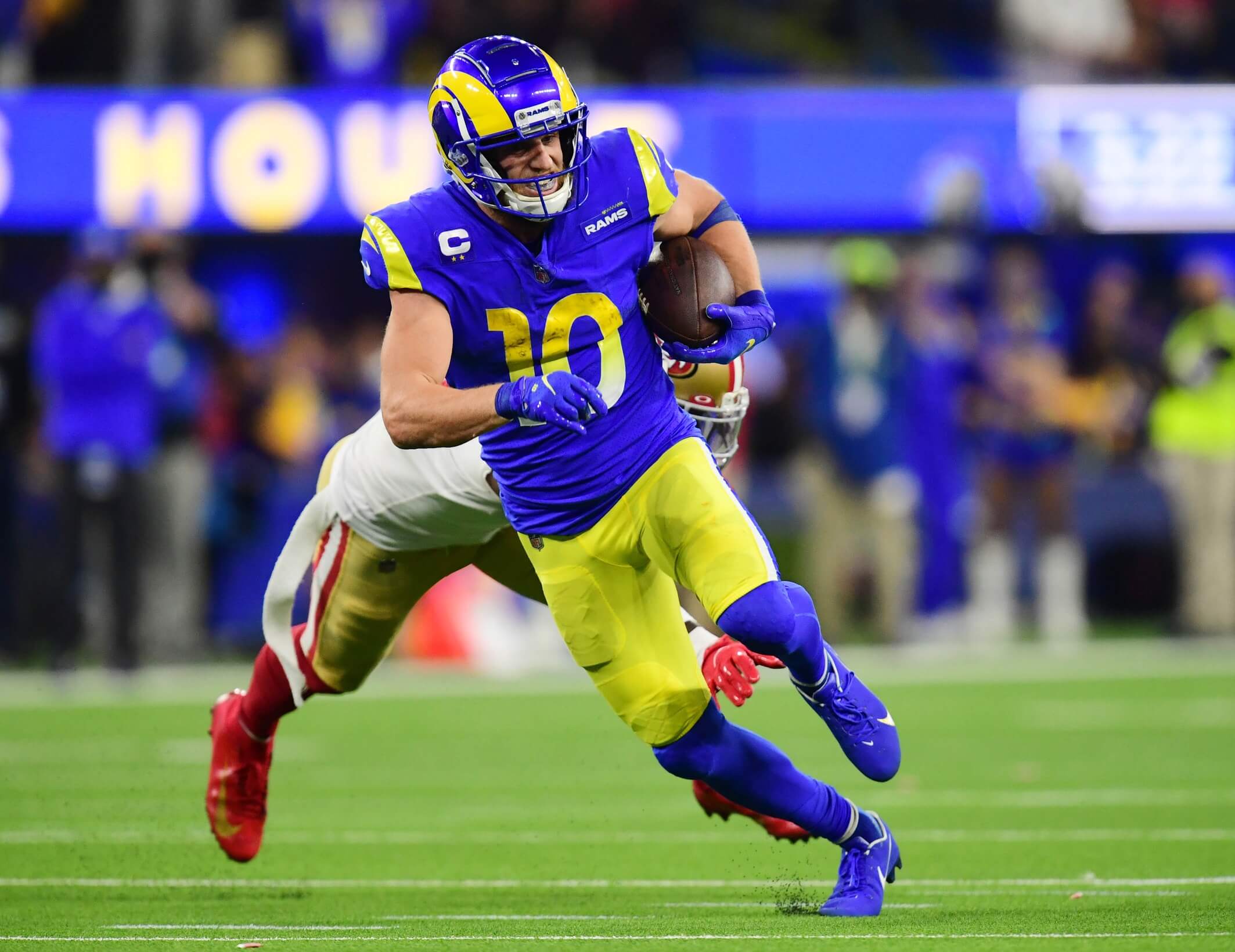 os Angeles Rams wide receiver Cooper Kupp (10) runs past San Francisco 49ers cornerback Emmanuel Moseley (4) in the fourth quarter during the NFC Championship Game at SoFi Stadium.
