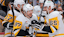 Pittsburgh Penguins center Sidney Crosby (87) celebrates with defenseman Erik Karlsson (65) after scoring against the Florida Panthers during the third period at Amerant Bank Arena.