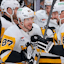 Pittsburgh Penguins center Sidney Crosby (87) celebrates with defenseman Erik Karlsson (65) after scoring against the Florida Panthers during the third period at Amerant Bank Arena.