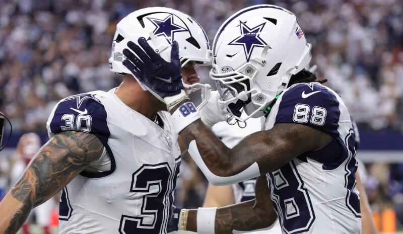 Dallas Cowboys wide receiver CeeDee Lamb (88) celebrates fullback Hunter Luepke (30).