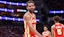 Atlanta Hawks guard Trae Young (11) reacts towards a fan.