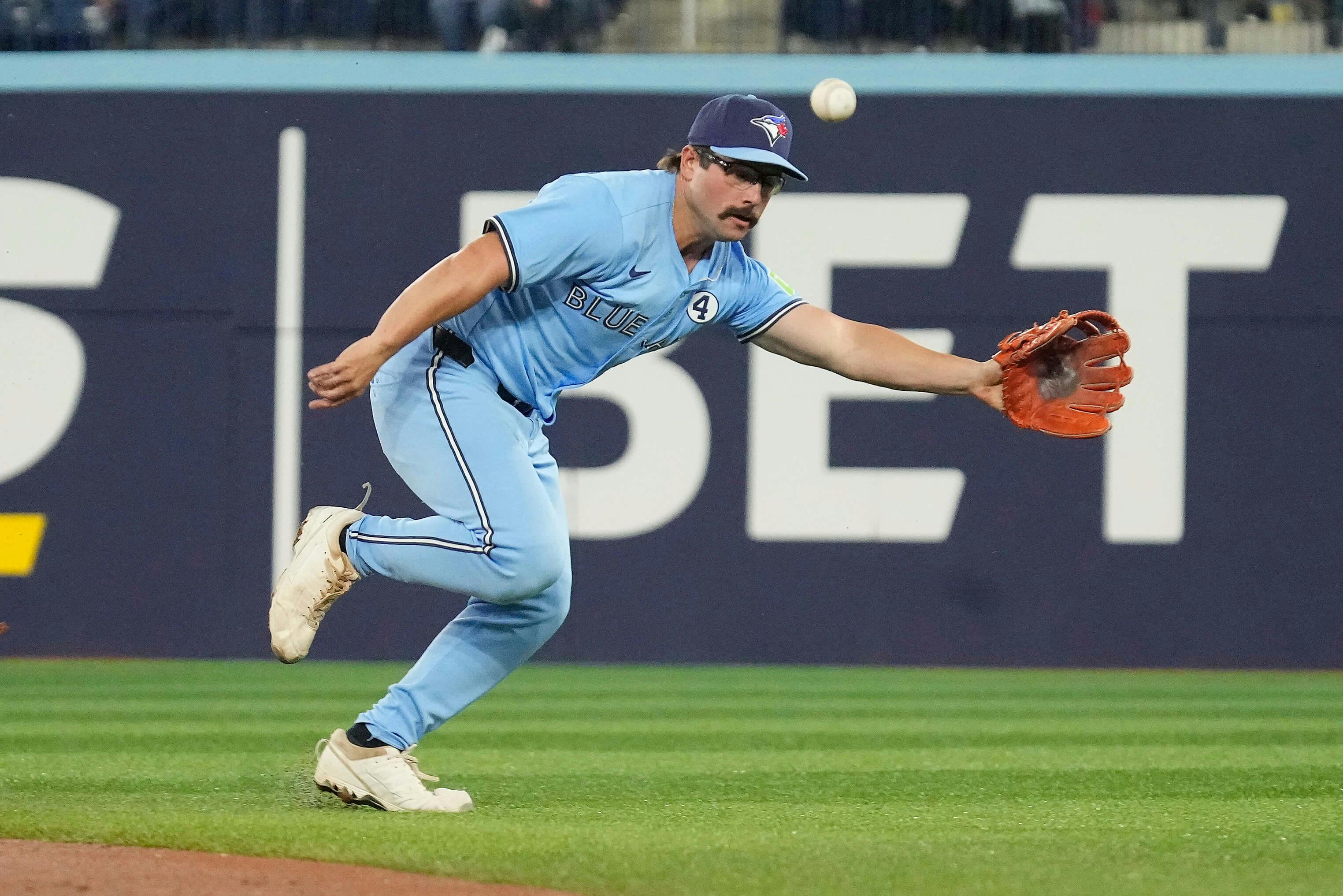 Toronto Blue Jays second baseman Davis Schneider (36) can't reach a ball hit by Oakland Athletics shortstop Jacob Wilson (not pictured) during the first inning at Rogers Centre. John E. Sokolowski-Imagn Images