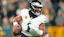 Philadelphia Eagles quarterback Jalen Hurts (1) rolled out against the Green Bay Packers in the first half at Lambeau Field.