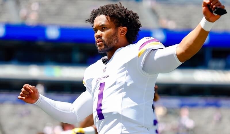 Minnesota Vikings quarterback Kyler Murray looks to pass the ball.