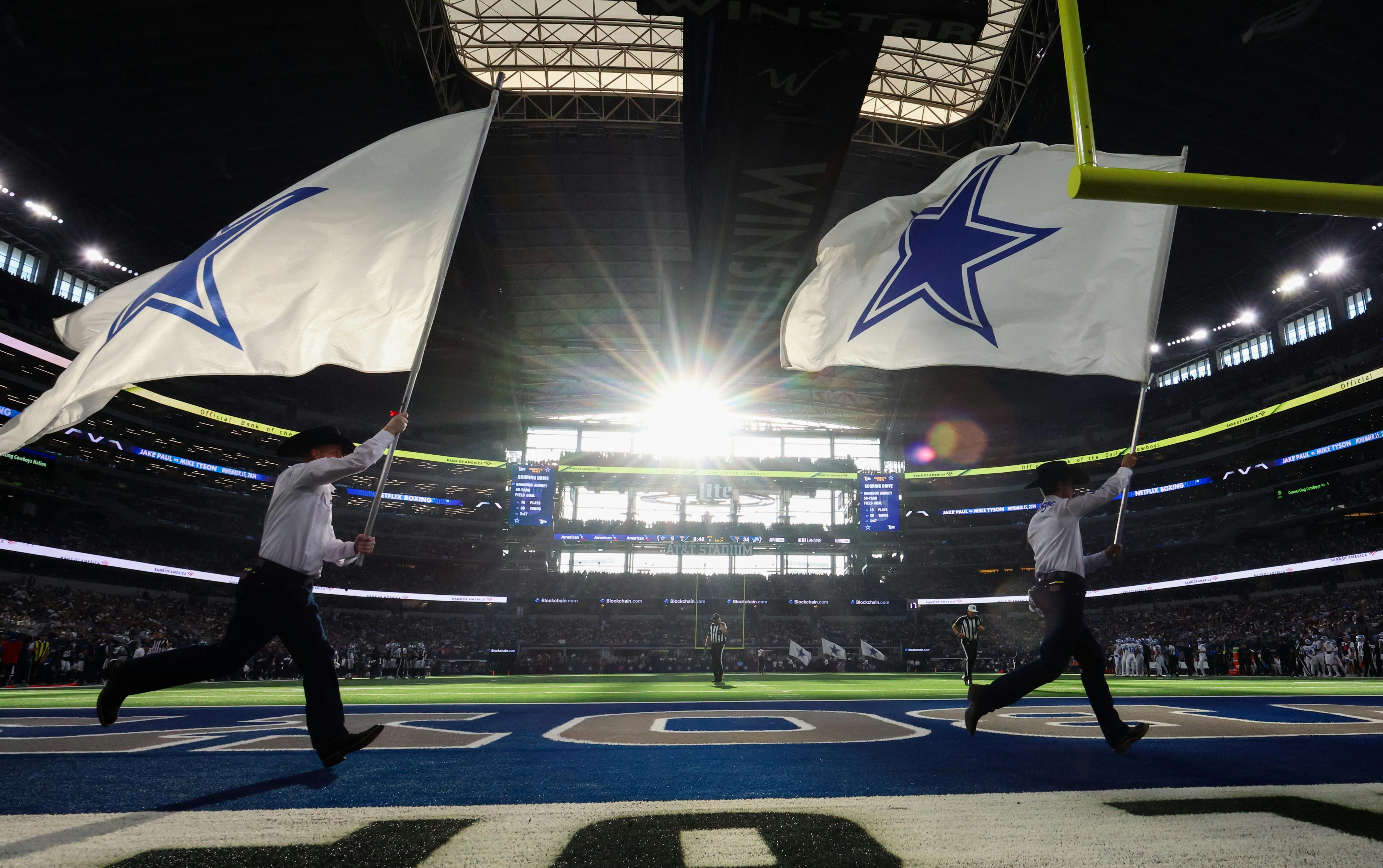 A general view of the field as flag runners run by after a Dallas Cowboys score against the Detroit Lions at AT&T Stadium. Mandatory Credit: Kevin Jairaj-Imagn Images