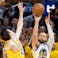 Golden State Warriors guard Stephen Curry (30) shoots the basketball against Los Angeles Lakers guard Austin Reaves (15).