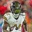Imagn Images. Pictured: Alvin Kamara taking off with the ball.