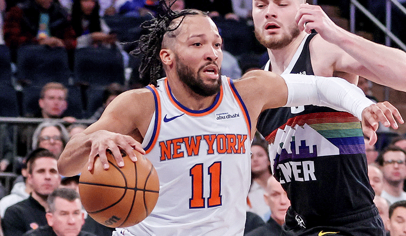 Jalen Brunson (11) drives past Denver Nuggets guard Christian Braun (0) in the second overtime at Madison Square Garden.