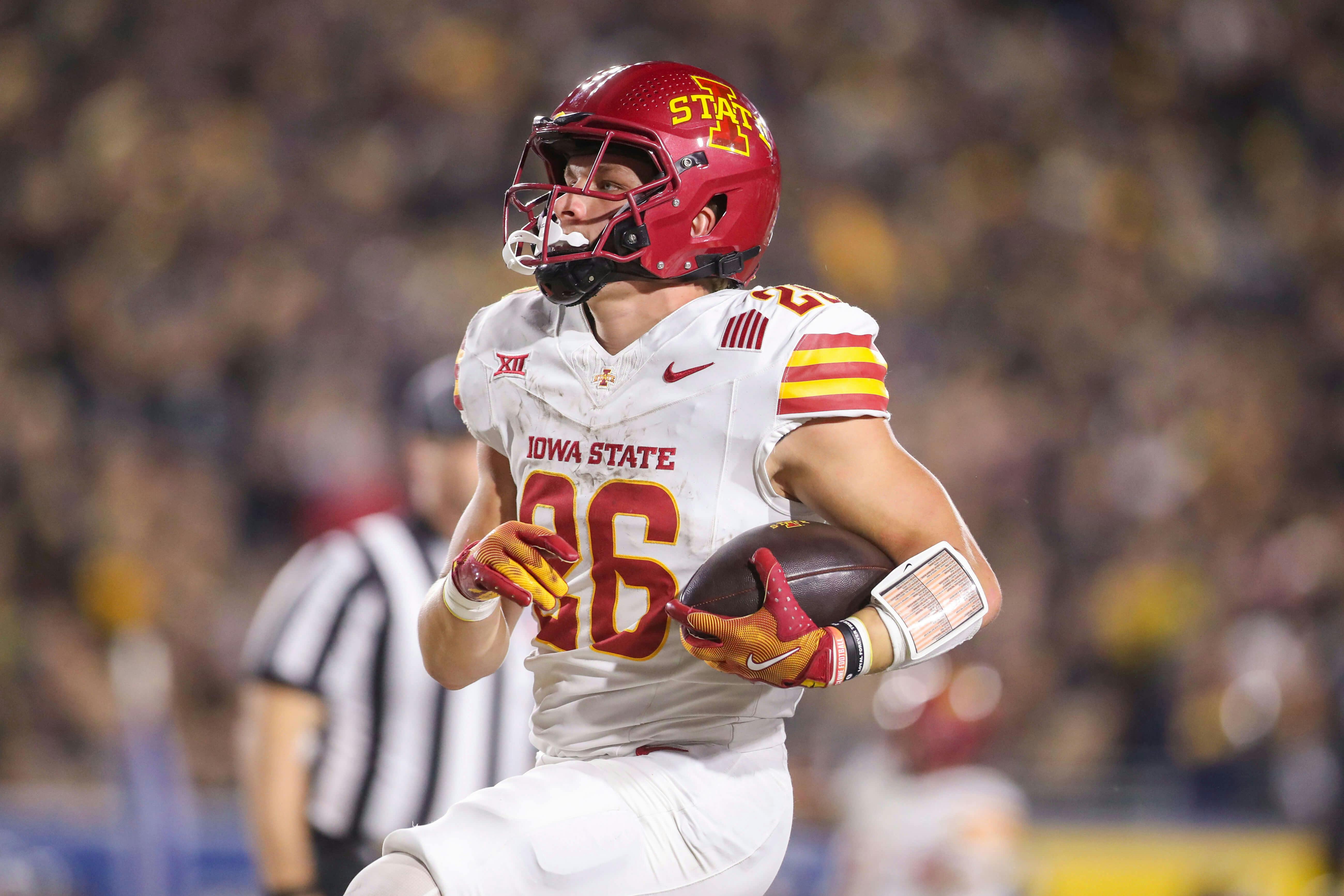 Iowa State Cyclones running back Carson Hansen (26) runs the ball for a touchdown against the West Virginia Mountaineers during the second quarter at Mountaineer Field at Milan Puskar Stadium. Mandatory Credit: Ben Queen-Imagn Images