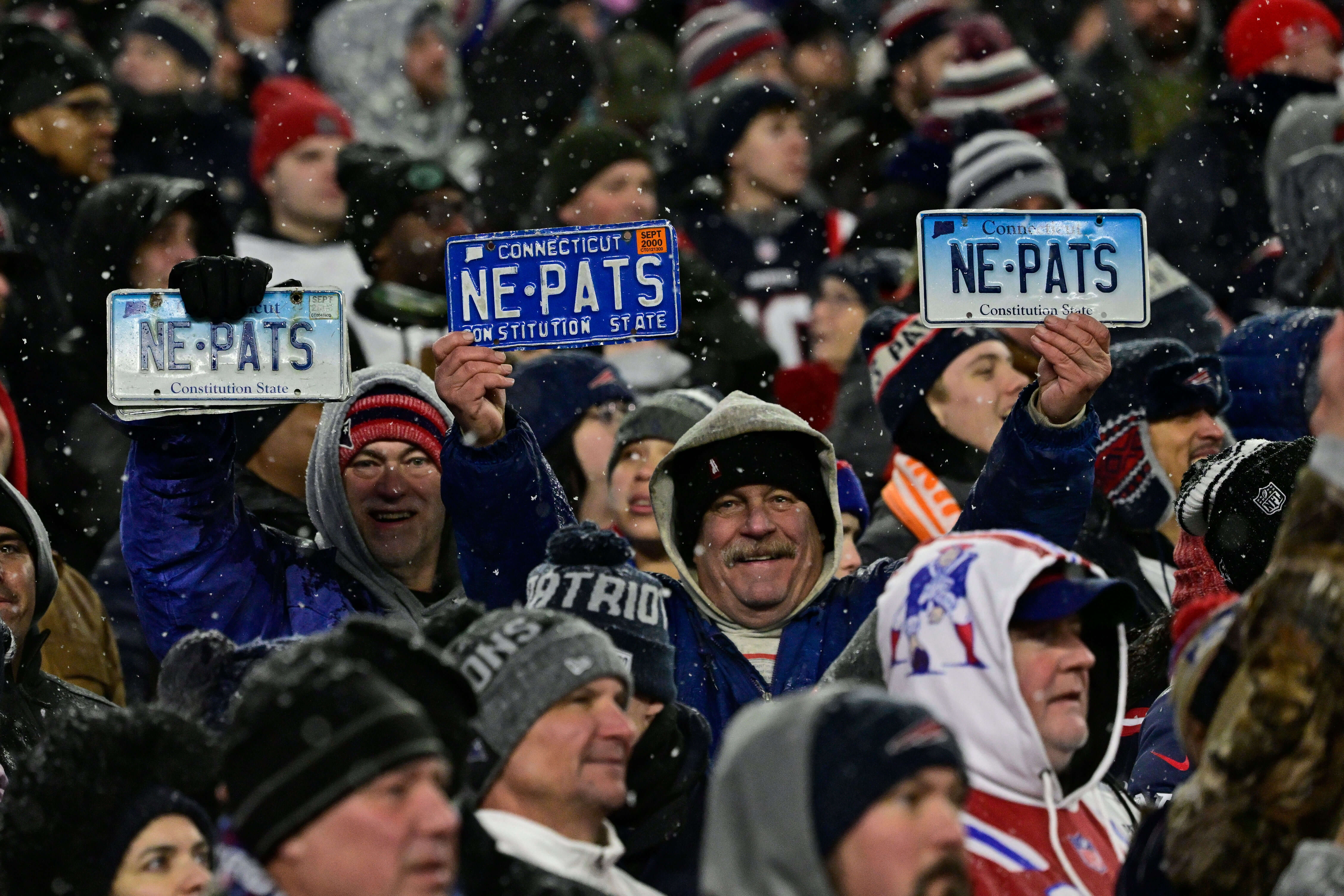 New England Patriots fans hold up Patriots license plates during the second half of the AFC divisional playoff round against the Houston Texans at Gillette Stadium, in Foxborough, Massachusetts. Eric Canha/CSM/Sipa USA