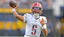 Washington Commanders quarterback Jayden Daniels (5) looks to pass against the Los Angeles Chargers at SoFi Stadium.