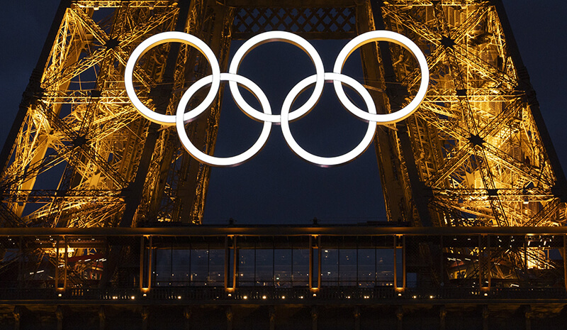 France; A detail view of the Olympic Rings displayed on the Eiffel Tower ahead of the 2024 Paris Olympics.