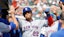 New York Mets outfielder Juan Soto (22) receives congratulations from teammates.