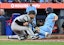 Toronto Blue Jays left fielder Davis Schneider (36) scores as New York Yankees catcher J.C. Escarra (25) misses the throw from pitcher Max Fried (not shown) in the fifth inning at Rogers Centre. Dan Hamilton-Imagn Images