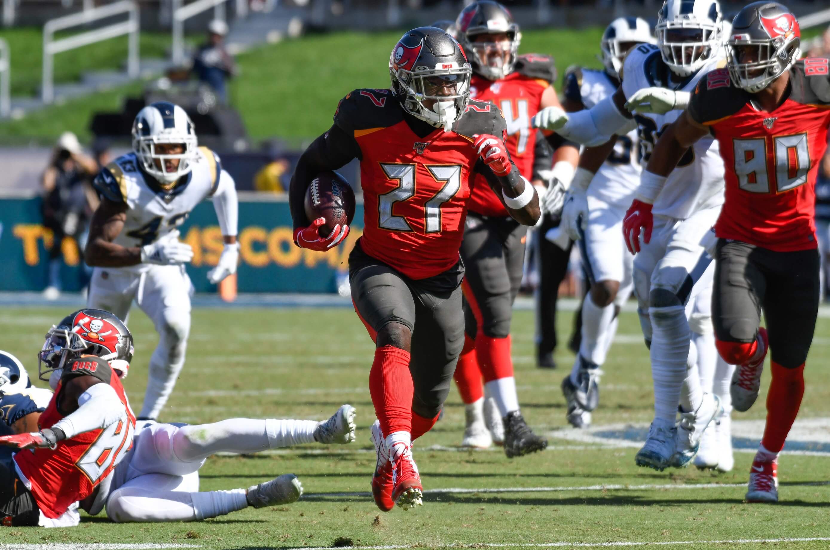Tampa Bay Buccaneers running back Ronald Jones (27) runs through the Los Angeles Rams defense during the 2nd half at Los Angeles Memorial Coliseum on Sept 29, 2019. It is the one of the highest scoring games in NFL history.
