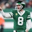 New York Jets quarterback Aaron Rodgers (8) gestures towards the Miami Dolphins bench.