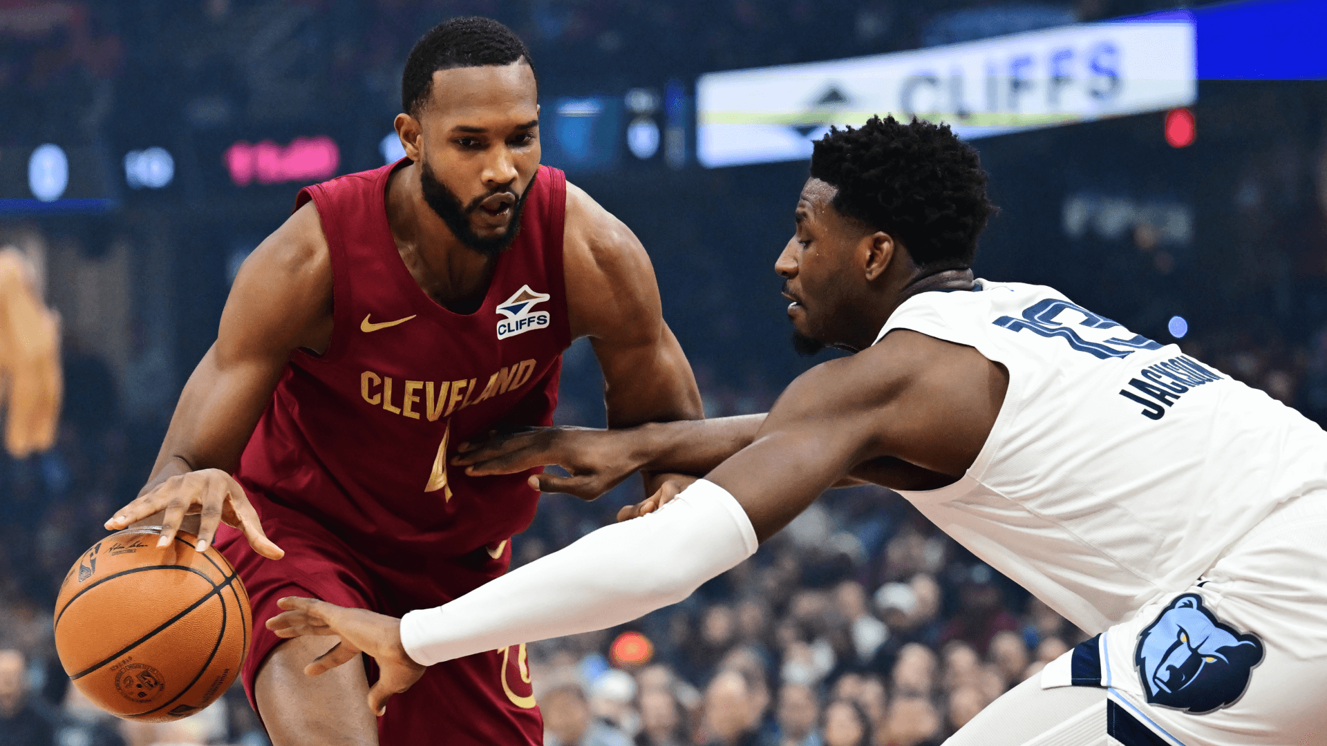 Cleveland Cavaliers forward Evan Mobley (4) drives to the basket against Memphis Grizzlies forward Jaren Jackson Jr. (13).