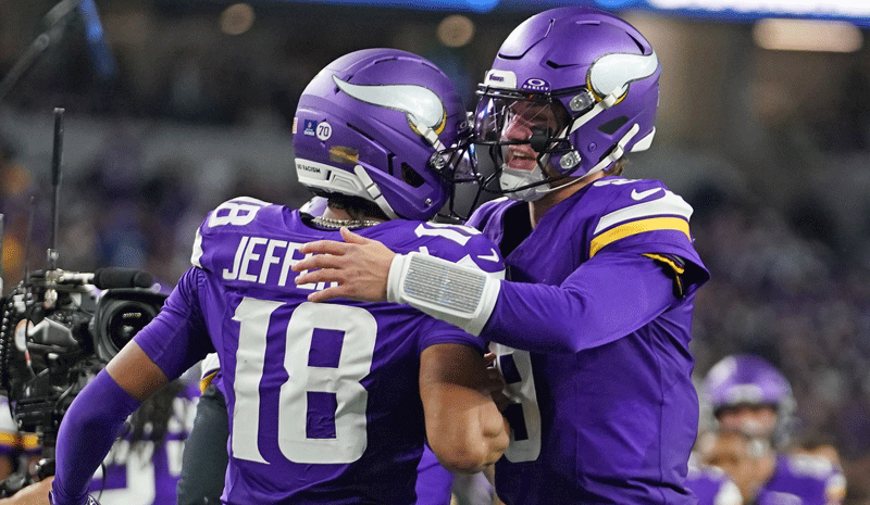 Minnesota Vikings wide receiver Justin Jefferson (18) celebrates with quarterback J.J. McCarthy (9) after a Vikings touchdown during the second half against the Dallas Cowboys at AT&T Stadium.