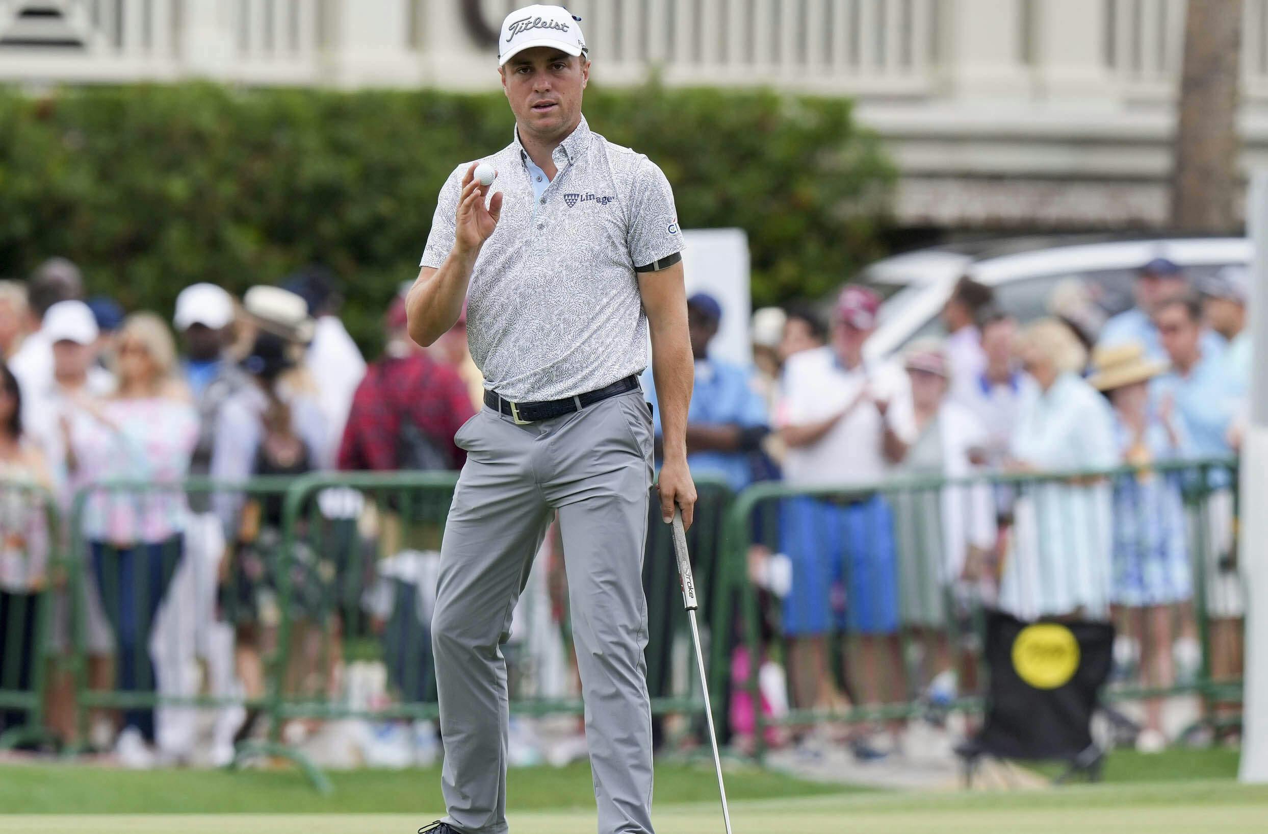 Justin Thomas acknowledges the crowd after a birdie putt during the third round of the RBC Heritage golf tournament.