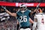 Philadelphia Eagles running back Saquon Barkley (26) celebrates after a touchdown against the Washington Commanders.
