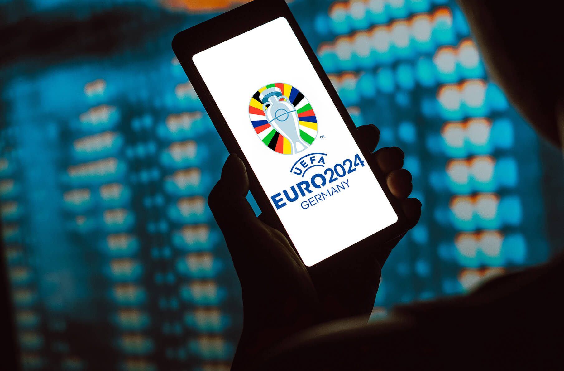 The UEFA European Football Championship logo is displayed on a smartphone screen. UEFA European Football Championship (Euro 2024 Germany) it is the main football championship between men's teams from European countries belonging to UEFA. 