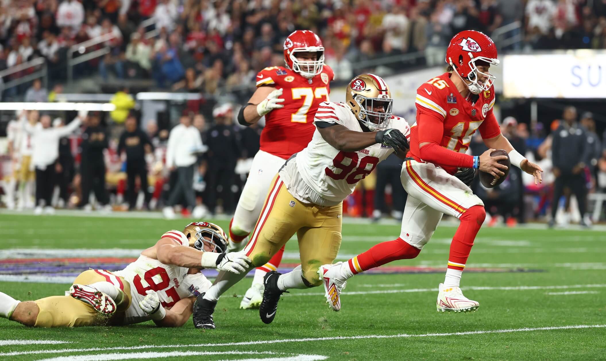 Kansas City Chiefs quarterback Patrick Mahomes (15) is pressured by San Francisco 49ers defensive tackle Javon Hargrave (98) in the fourth quarter in Super Bowl LVIII at Allegiant Stadium.