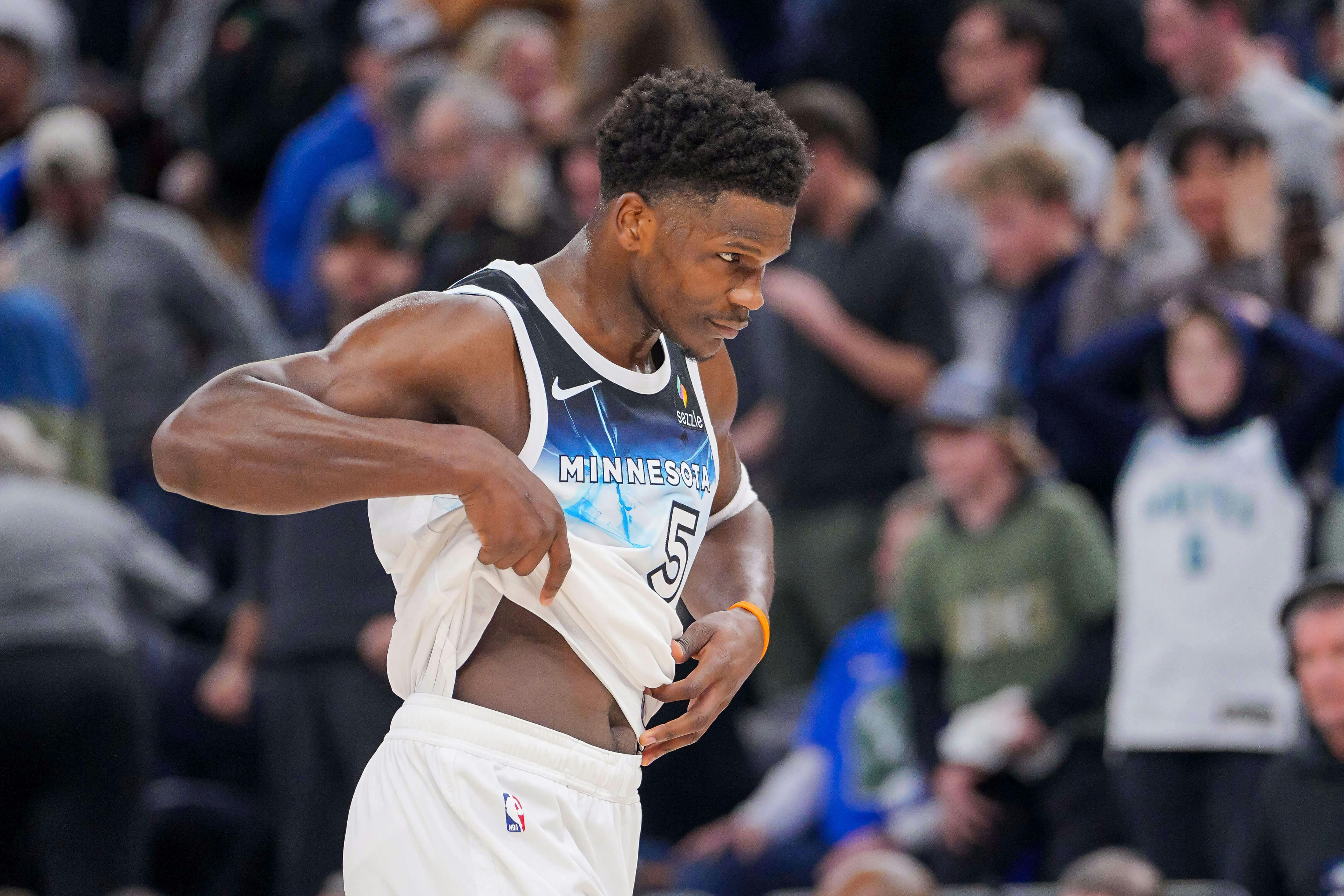 Minnesota Timberwolves guard Anthony Edwards (5) walks off the court after losing to the Milwaukee Bucks at Target Center. Mandatory Credit: Brad Rempel-Imagn Images