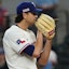 Texas Rangers pitcher Jacob deGrom (48) looks in for the sign during the fourth inning.